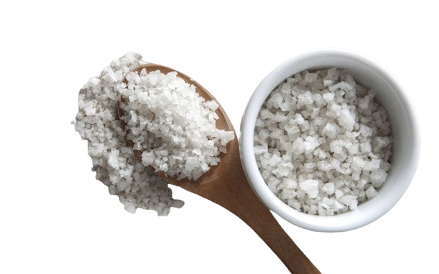 A close-up shot of light-grey celtic sea salt fine ground in a wooden bowl, showcasing the moist, mineral-rich texture of authentic celticseasalt.