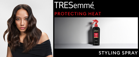 A bottle of TRESemmé Thermal Creations Heat Protection Spray being applied to hair to prevent heat damage.