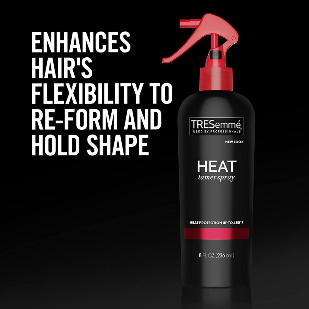 A bottle of TRESemmé Thermal Creations Heat Protection Spray being applied to hair to prevent heat damage.