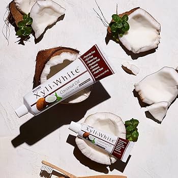 A tube of NOW Foods Solutions XyliWhite Refreshing Toothpaste Gel in Refreshmint flavor featuring a 25% xylitol fluoride-free formula.