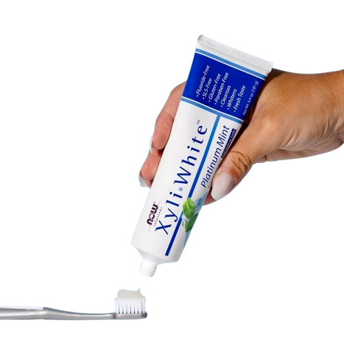 A tube of NOW Foods Solutions XyliWhite Refreshing Toothpaste Gel in Refreshmint flavor featuring a 25% xylitol fluoride-free formula.