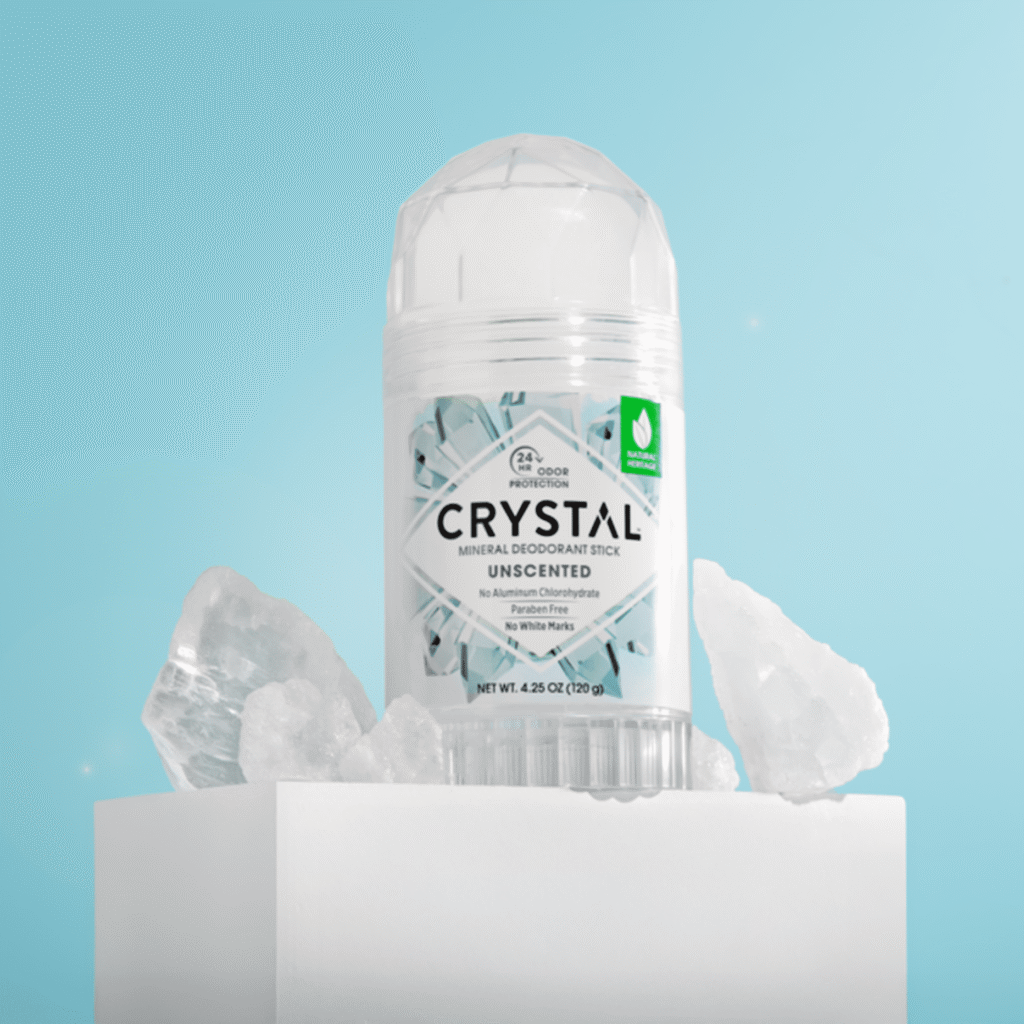 A 120g CRYSTAL mineral deodorant stick unscented sitting on a bathroom counter, showcasing its clear natural salt stone texture